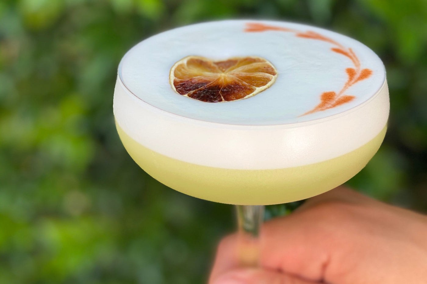 A Jimmy Slings passionfruit sour with a dried orange heart